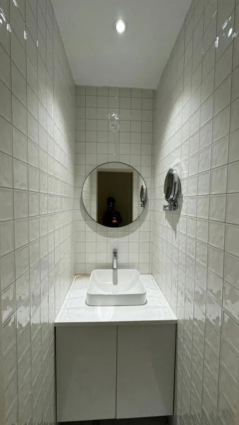 Bathroom vanity with round mirror