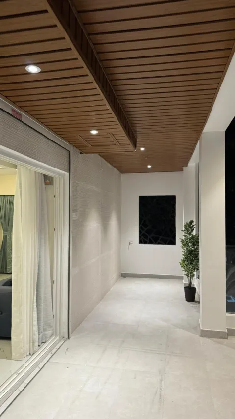 Corridor with wooden slatted ceiling