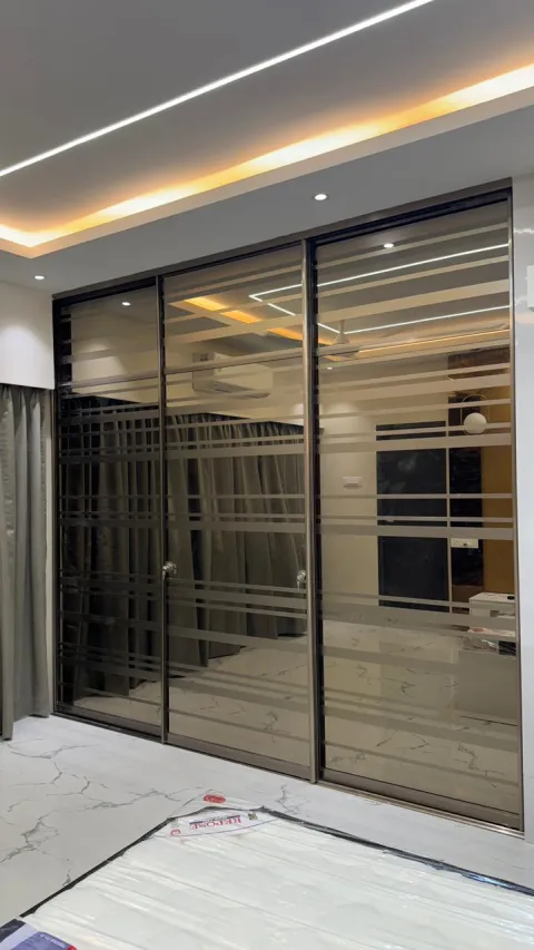 Walk-in wardrobe with glass sliding shutters