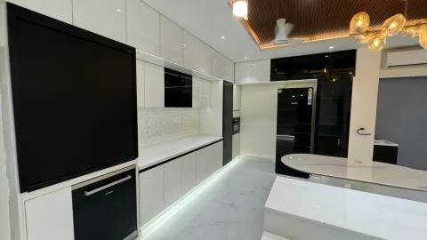Open kitchen with glossy units